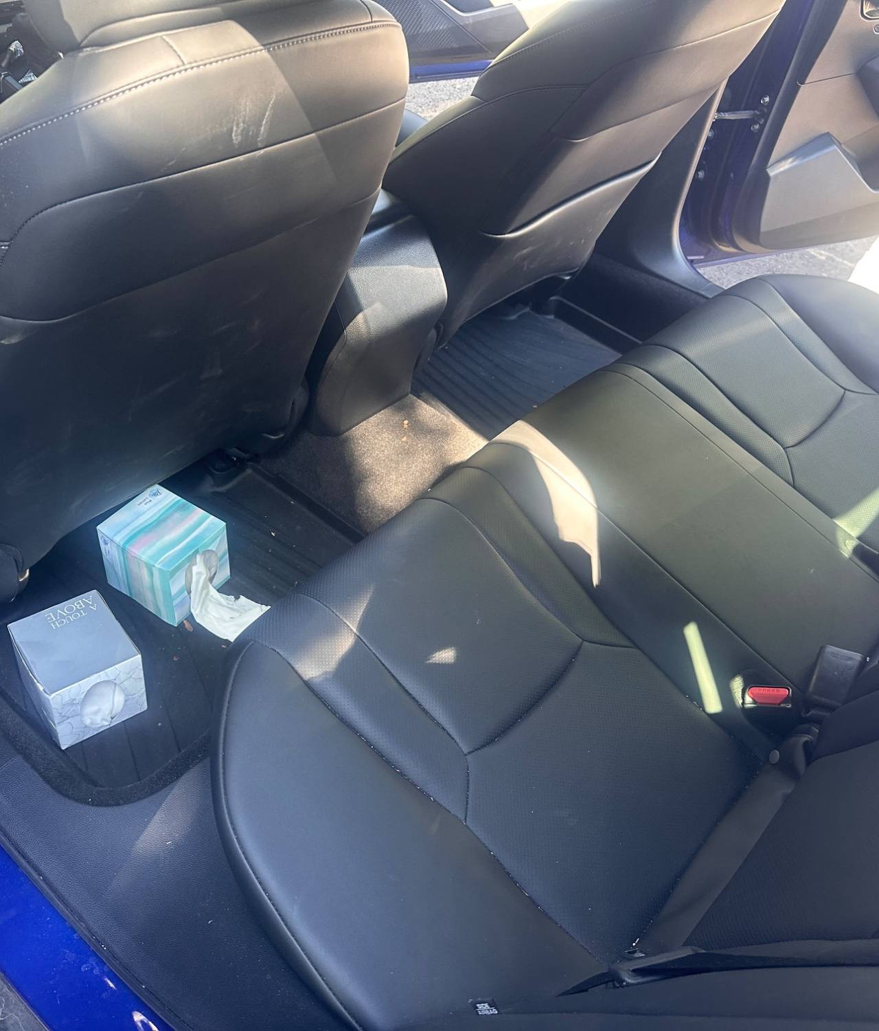 Blue Honda Civic BEFORE rear interior detail by Detail Jockey — dirty backseats, scuffed seatbacks, dust and tissue boxes on floor mat, NJ⁠