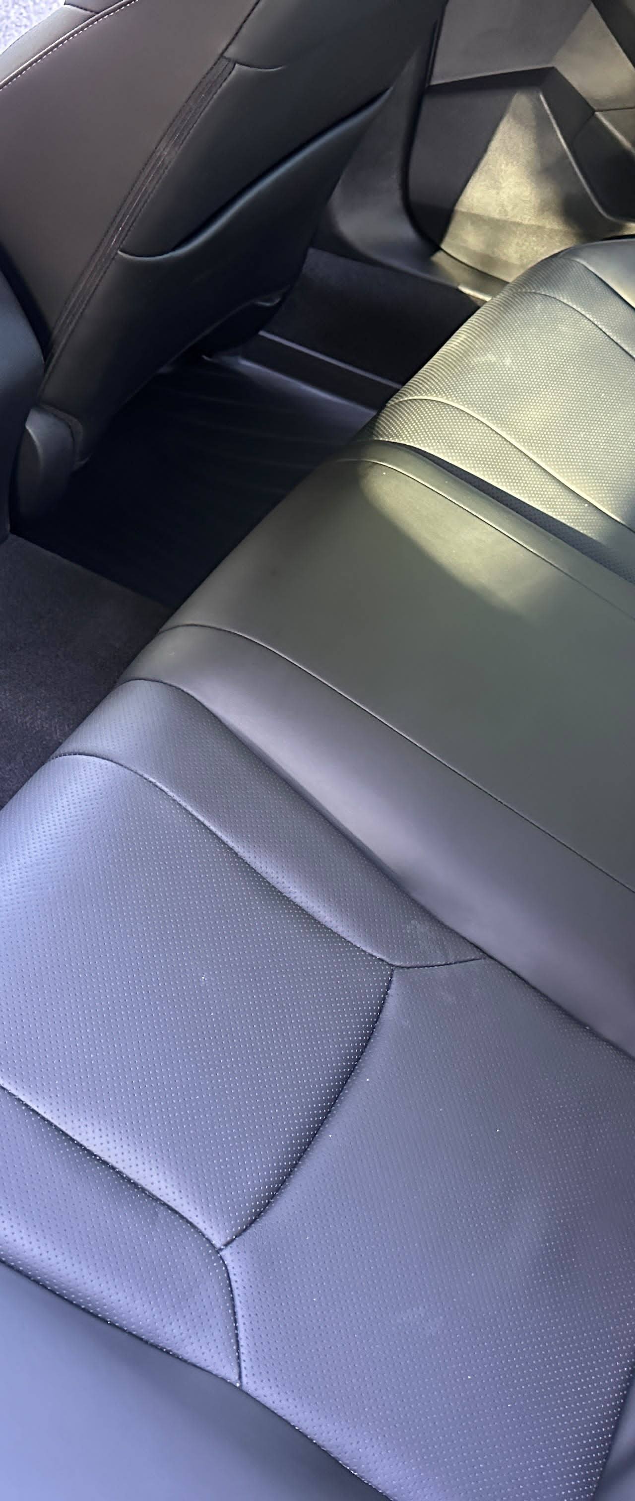 Blue Honda Civic AFTER rear interior detail by Detail Jockey — deep cleaned leather backseats, wiped seatbacks and spotless rubber floor mats, NJ⁠