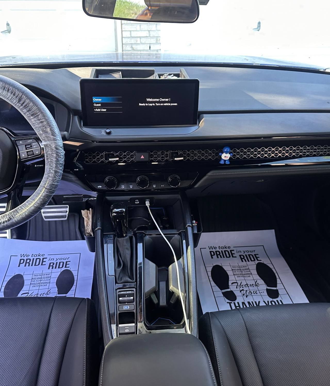 Blue Honda Civic AFTER interior detail by Detail Jockey — protected steering wheel, wiped dashboard and fresh paper floor mats, NJ⁠